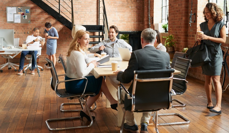 Exciting boardroom meeting with business people in trendy office